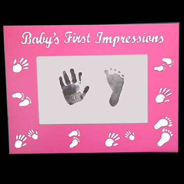 Pink babys first impressions photo frame with hand and foot print imprints