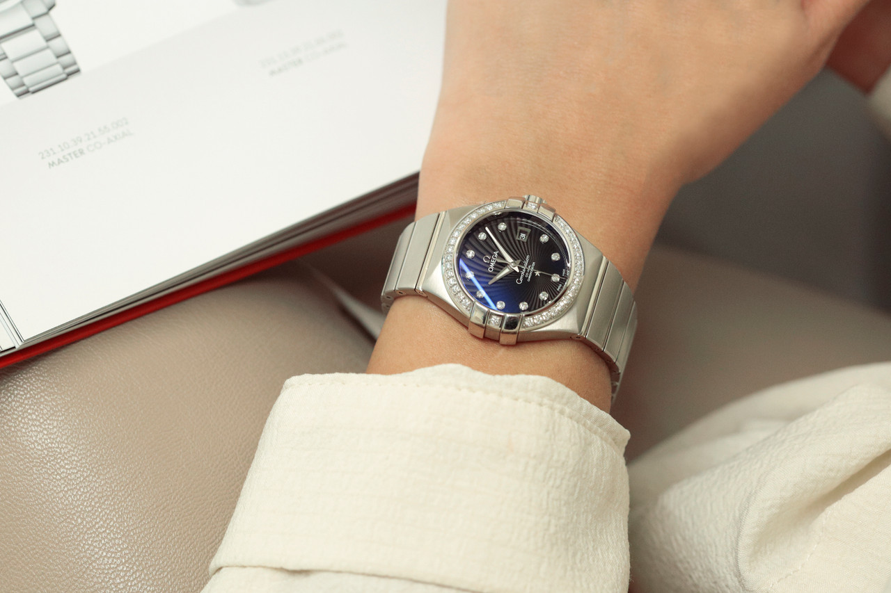 Woman wearing stainless steel watch on wrist