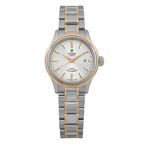 An image of a Tudor Style 28 ladies wristwatch, displayed from a straight-on angle at a close distance. The watch features a stell and yellow gold bracelet, a silver dial, and a date indicator positioned at 3 o'clock. The bezel and hour markers are gold, complementing the overall design. The watch is in an unworn condition.