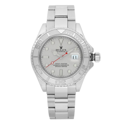 An image of a pre-owned wristwatch viewed from the front in a full frontal perspective. The watch features a metal bracelet and a detailed bezel with engraved numbers. The dial is light-colored with circular hour markers and a date window. The watch is positioned centrally and captured at a close distance, highlighting its intricate design and craftsmanship.