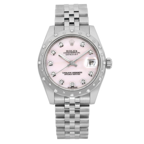 An image of a pre-owned wristwatch displayed from a front full frontal view. The watch features a silver metal band and a round face with a light pink dial. The watch hands and hour markers are silver, and the face includes diamond accents. The brand name is visible on the dial. The image is taken at a close distance, highlighting the details of the watch's design.