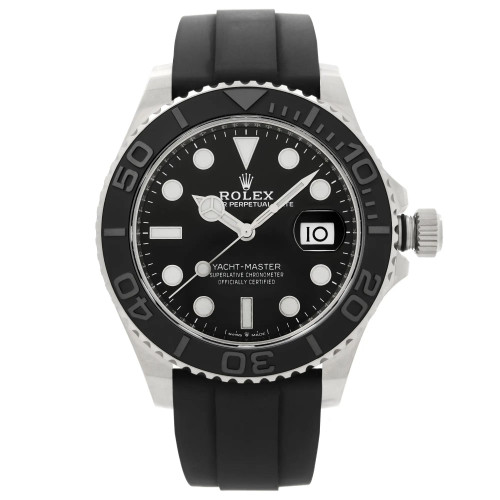 An image of a pre-owned wristwatch viewed from a front full frontal angle. The watch features a black dial with large white markers and a date display at the 3 o'clock position. The bezel is black with silver numerals, and the watch is attached to a black strap. The crown is prominent on the right side, viewed closely to capture details.