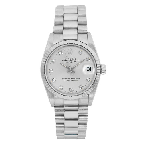 An image of a pre-owned wristwatch shown from a front full frontal view. The watch features a metallic band and a silver dial with diamond hour markers. The date is visible on the right side of the dial, and the overall condition appears well-maintained. The image captures the watch at close range, highlighting its intricate details.