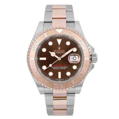 An image of a pre-owned wristwatch displayed in a front full frontal view. The watch features a metallic bracelet with alternating rose gold and silver links. The bezel is rose gold, contrasting with the dark brown dial. The hour markers are circular with a date window at 3 o'clock. The brand name is not specified.