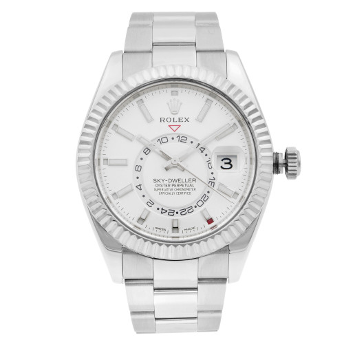 An image of a pre-owned wristwatch captured from a front full frontal view. The watch features a silver bracelet and a white dial with various markings. The date is visible through a magnified window on the right side. The image is taken from a close distance, providing a clear and detailed view of the watch's face and design elements.