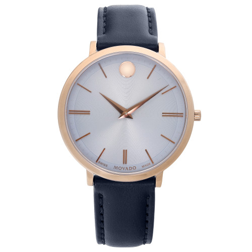 An image of a wristwatch in a front full frontal view, showcasing its round face with a minimalist design. The watch features a gold-toned case and a sleek, black leather strap. The dial is silver with gold hour markers and hands, and a single dot at the 12 o'clock position. The watch is new but has defects, and the image is captured at a close distance to highlight its details.