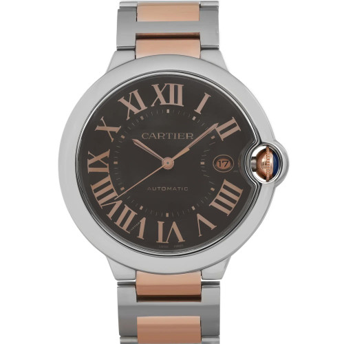 An image of a pre-owned wristwatch captured from a front full frontal view. The watch features a round case with a two-tone metal bracelet. The dial displays Roman numerals and a date window, with the brand name visible. The crown is positioned on the right side of the watch. The image is taken at a close distance, highlighting the watch's details and craftsmanship.