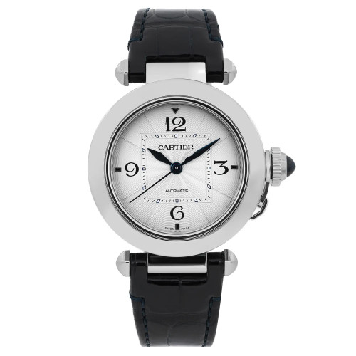 An image of a pre-owned Cartier Pasha Steel men's 35mm silver dial automatic wristwatch, captured from a straight-on angle, showcasing the watch face prominently. The watch features a circular silver dial with black numerals and a black leather strap. The crown is visible on the right side, detailed with a blue cabochon. The photo is taken at a close distance, highlighting the elegant design and details of the watch.