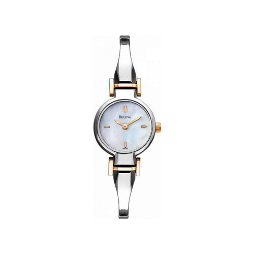 An image of a pre-owned Bulova women's dress/formal wristwatch, presented in a full frontal view. The watch features a round case and a white mother of pearl dial with stick indexes, framed by a steel bezel. It has a stainless steel band with gold-tone accents.