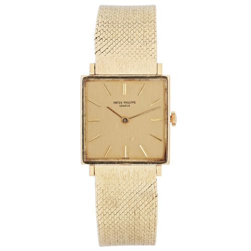 An image of a pre-owned unisex Vintage Patek Philippe Gondolo 18K Yellow Gold Dial Hand Wind Watch 3430, positioned upright and viewed directly from the front. The watch features a square gold face with minimalist hour markers and a textured yellow gold band. The image is taken at a close distance, showcasing the intricate details of the watch's design.