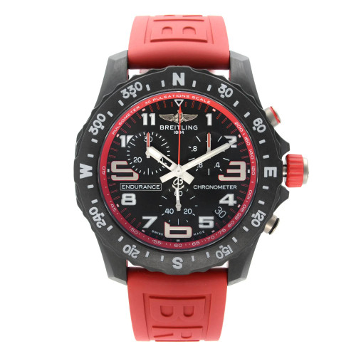 An image of a Breitling men's wristwatch in a sport style, shown in a full frontal view. The watch features a round black dial with Arabic numerals and 12-hour indices, a matching black bezel, and a red rubber band. The case is made of Breitlight material. The condition is excellent and appears as a display model. The watch is photographed from the front at a close distance, showcasing the face and band clearly with no obstructions. Can have minor blemishes on the watch during handling and shipping. 