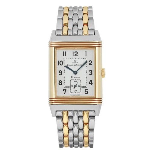 An image of a pre-owned Jaeger-LeCoultre Reverso men's wristwatch in good condition. It is presented in a front full frontal view, centered and filling the frame. The watch features a rectangular yellow gold case with a silver dial, gold bezel, and a 12-hour dial with Arabic numerals. A small seconds subdial is visible within the main dial. The band is made of alternating stainless steel and yellow gold links, and the crown is positioned on the right side of the case. The watch is photographed against a neutral background, highlighting its luxury style.