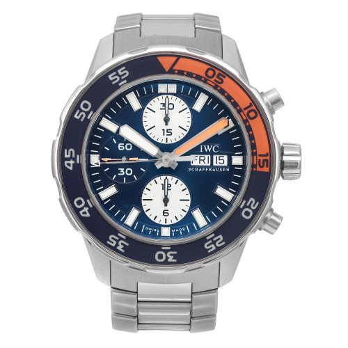 An image of a pre-owned IWC men's diver wristwatch in a full frontal view. The watch features a round stainless steel case and band, with a blue dial and blue and orange bezel. It has stick indexes and a 12-hour dial with three sub-dials. The watch is positioned centrally and shown from a direct, head-on angle, filling most of the frame for a clear view of its details. The watch is pre-owned and shows light signs of wear or scratches.