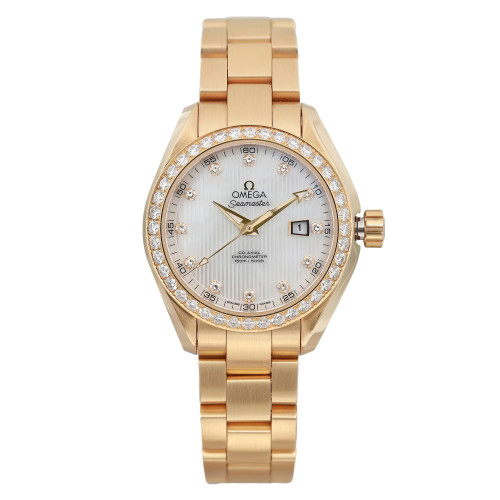 An image of an unworn OMEGA women's luxury wristwatch in excellent condition, presented in a full frontal view from a medium distance. It features a round watch shape with a white mother of pearl dial, gold bezel adorned with diamonds, and yellow gold case and band. The dial has diamond markers at each hour position, except at 3 o'clock where there is a date indicator, and luminous hands are visible. The OMEGA Seamaster logo is prominently displayed on the upper half of the dial. The watch is positioned straight on, allowing for a clear and detailed view of its features.