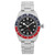 An image of a men's luxury sport wristwatch by TUDOR, shown from a front full frontal view. The unworn watch features a round black dial with non-numeric hour marks and round indexes, complemented by luminous hands and a seconds hand. The bezel is colored blue and red, and the watch includes features such as a date indicator and GMT. The band and case are made of stainless steel. The photograph captures the watch in a straightforward manner, highlighting its design and details.