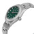An image of a new wristwatch shown from a side profile view, highlighting the crown. The watch has a metallic band and a green dial, with silver hour markers and hands. The angle reveals the sleek design of the case and the detailed crown, creating a dynamic perspective from a close distance.