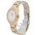 An image of a pre-owned COVER women's wristwatch featuring a gold-tone metal band and a round face. The watch is positioned at a slight angle, showcasing the luminous hands and the bezel adorned with crystals. The shot is taken from a close distance, highlighting the intricate details on the band and clasp.