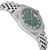 An image of a pre-owned men's Rolex wristwatch viewed from a slight side angle, showcasing its elegant stainless steel band and a green dial with Roman numeral markers. The watch features luminous hands and a date indicator, and is adorned with a diamond-set bezel. The angle highlights the watch's detailed craftsmanship and luxurious design.