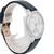 An image of a Skagen women's wristwatch, new with defects, displayed at a slight angle from the front. The watch features a marble-patterned face with a minimalistic design and a silver-toned bezel. The black leather strap is partially visible, wrapped around a transparent stand. The brand name "Skagen" is visible on the watch face. The photo is taken from a close distance, capturing the details of the watch's design.
