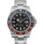 An image of a pre-owned Rolex GMT-Master II men's wristwatch with a front close-up view of the round watch face. The watch is presented at a straight-on angle with a clear view of the black dial and blue and red bezel. It features a white gold band and case. The condition is excellent with possible light scratches from previous use. The dial has round indexes, a 12-hour layout with a date indicator at the 3 o'clock position, and luminous hands. Visible are the distinctive Rolex logo and the words "Superlative Chronometer Officially Certified" on the dial. The watch is positioned centrally in the frame, filling most of the image for detailed viewing.