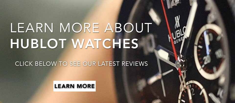 up-close image of a Hublot watch with a black dial and reg hand at its center