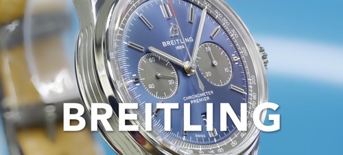 IMAGE OF A BLUE BREITLING ON A BLUE BACKDROP