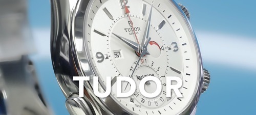 IMAGE OF A TUDOR WATCH ON BLUE BACKDROP