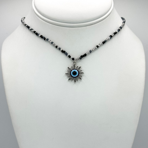 Black & white Beaded Chain with adjustable silver findings with Silver Evil Eye Sun Pendant.