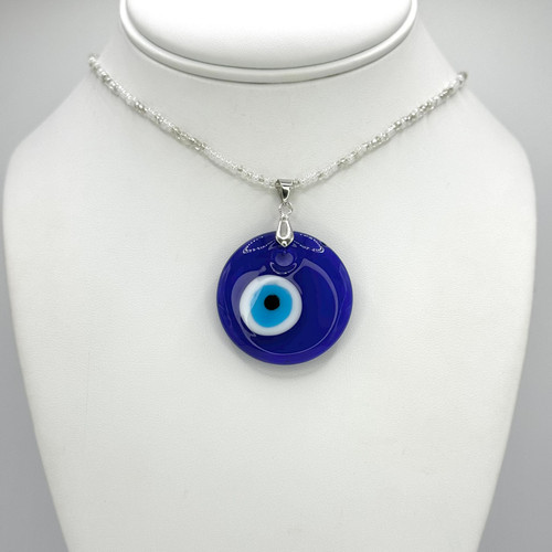Clear beaded Necklace with adjustable silver findings with Big Blue Evil Eye Pendant.