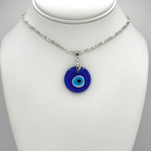 Clear Beaded Necklace with silver adjustable findings with Medium blue Evil Eye Pendant.