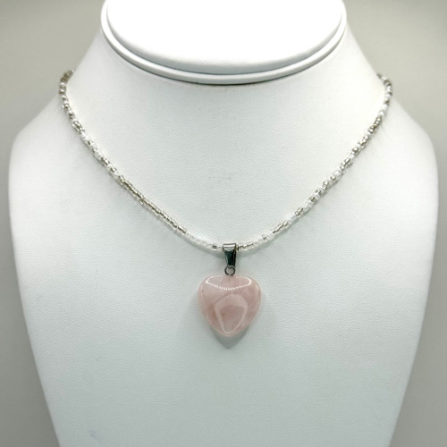 Rose Quartz crystal heart pendant on a beaded chain with silver findings.