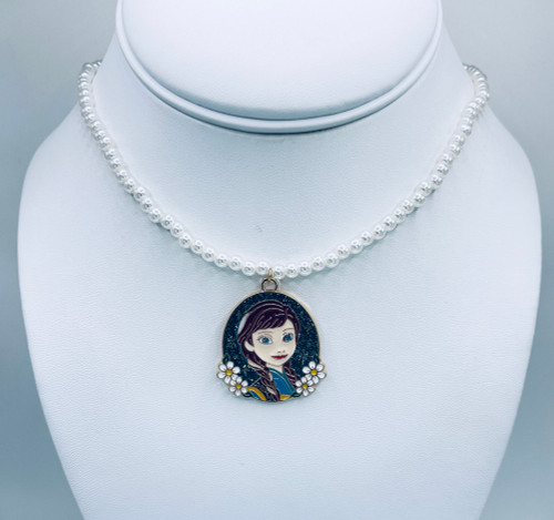 Enamel Anna Pendant on a white pearl chain with gold findings.