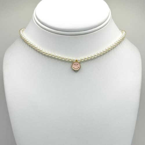 Baby pink and gold smiley pendant on a Pearl chain with gold 16inch to 18inch adjustable findings.