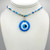 Blue White and Clear Beaded Chain with adjustable silver findings, with a Light Blue Evil Eye Pendant.