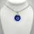 Small Blue Evil Eye Pendant on a beaded chain with adjustable silver findings