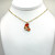 Powerpuff Girl Blossom Enamel necklace on a gold saturn chain with gold findings.