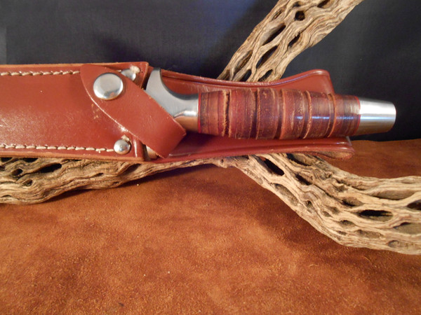 leather sheath and knife handlemay show minor handling