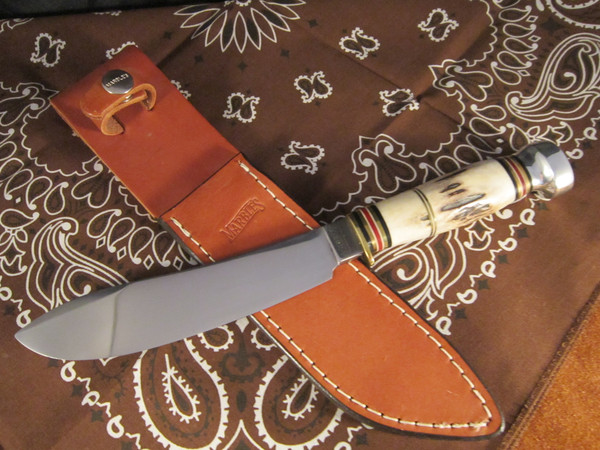 Marbles Brand side of blade on leather Marbles sheath.