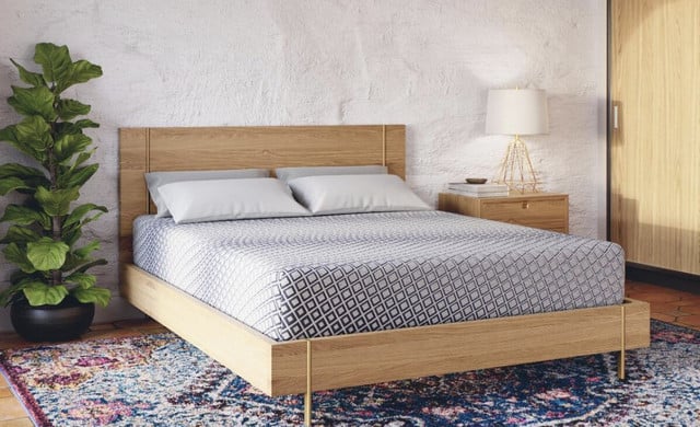 FORM Core mattress on an oak platform bed in a bright bedroom