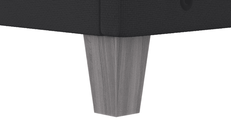 Close-up of a faux wood leg on the FORM Upholstered Foundation