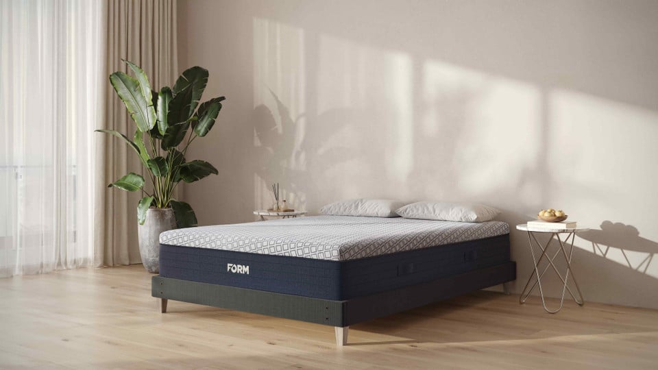 FORM Upholstered Foundation under a FORM mattress in a modern bedroom
