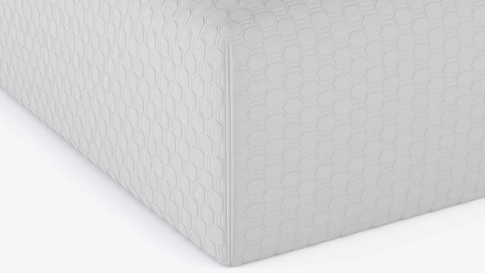 Close-up of the white nylon and polyester knit on the FORM Mattress Protector