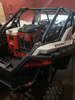 Polaris RZR PRO XP / Turbo R Packout Mount by AJK Offroad Right Side View with three Kits and one Cooler