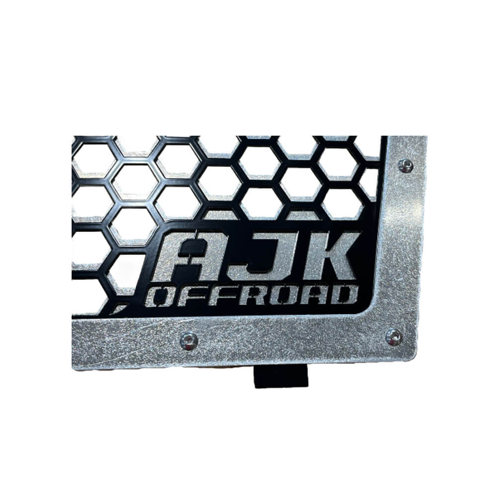Kawasaki KRX Front Grill by AJK Offroad in Raw Aluminum Close Up of Logo
