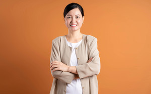 Matured Asian woman with folded arms Matured Asian woman with folded arms