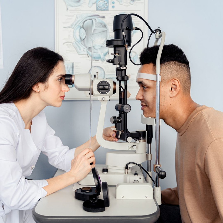Older gentleman having eye screening test for cataract