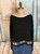 black appliqué sweater with white trim
