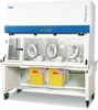 Esco Streamline SLC-RABS compounding aseptic isolator, 6 ft, three oval gloveports, positive pressure, shown with optional sharps disposal containers; this configuration ships with a plain work tray