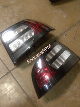 black bezel, red turn signal, clear brake diffuser with carbon fiber lower reflector