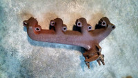 Driver exhaust manifold